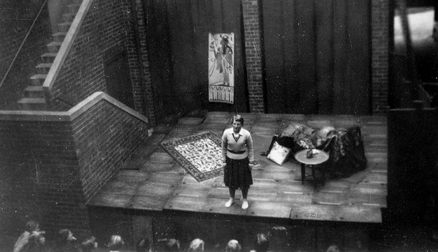 Old black and white photo of a Fintona student Archive photo of Fintona student performing on a stage